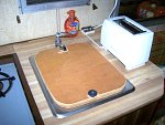 Had some nice finished interior plywood and made a new sink cover. The old one was in there, but was made from particle board and was coming all to...