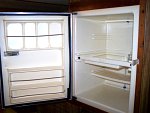 I pulled the fridge out, insulated the compartment with 1" styrofoam sheathing,cleaned and re-sealed the door, and installed it with new upgraded...