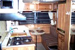 1984 Sunline F-1850 Fifth Wheel. Inside Rear View, showing kitchen & rear dinette, full length mirror on right is mounted on bathroom door. 
100...
