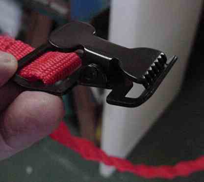 Battery hold down strap gripper.