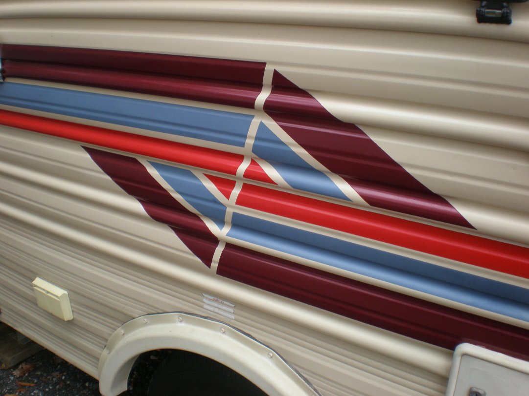 Repainted striping on door side, front, and back.