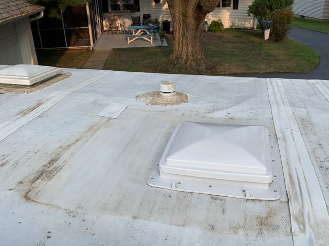 You can see the outline of the AC roof unit and the tear it caused when the metal pan hit the roof.  I patched it with Perma Bond.  Installed a ceiling fan, knowing I will have to remove it to repair the roof rafters in Colorado.