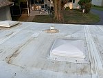You can see the outline of the AC roof unit and the tear it caused when the metal pan hit the roof.  I patched it with Perma Bond.  Installed a...