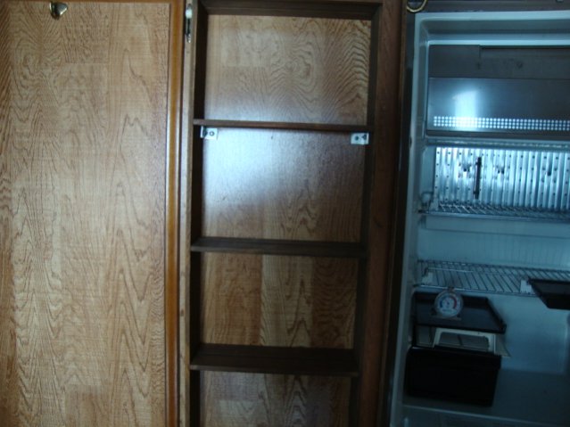 Not sure if this cabinet is original or not. Looks like a good place for canned goods though.