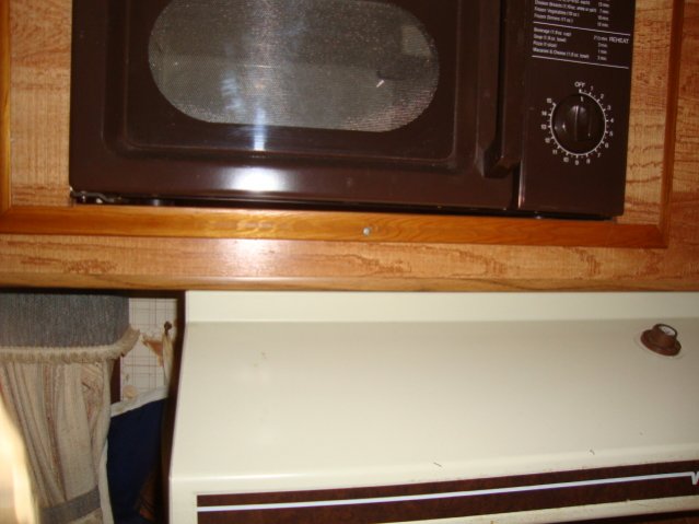 Microwave and stove hood. Another bad photo.