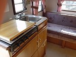 Sink and stove, plus couch that converts to bed